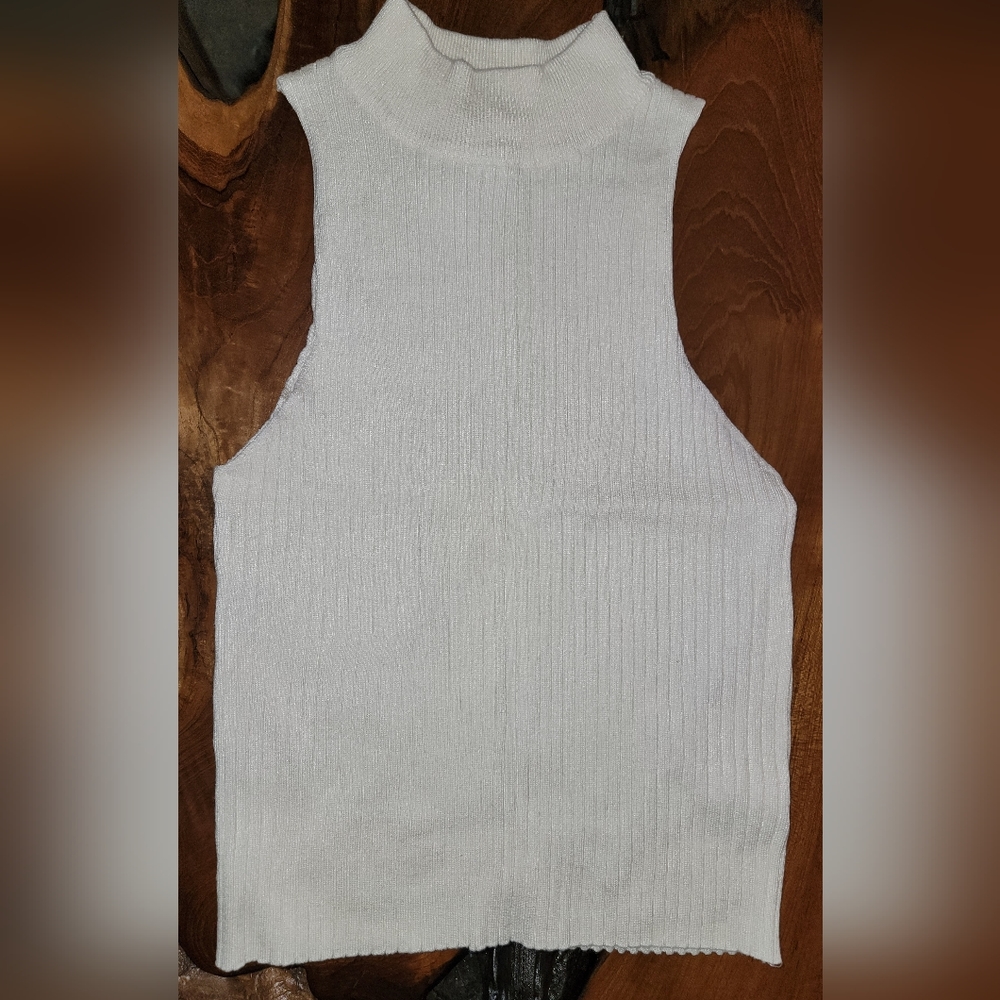 Cream colored turtle neck shirt